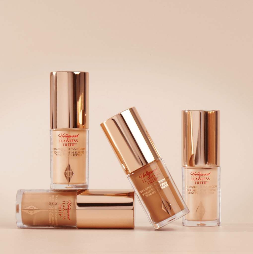 ''Charlotte Tilbury Hollywood Flawless Filter'' spīdīgais praimeris dažādos ādas toņos.